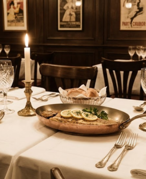 Elegant 1940s French restaurant table with sole meunière dish