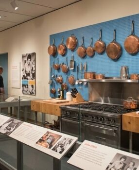 Julia Child's kitchen exhibit at the Smithsonian museum with pegboard and copper pots