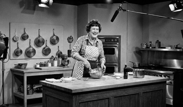 Julia Child cooking on The French Chef TV set with vintage 1960s kitchen equipment